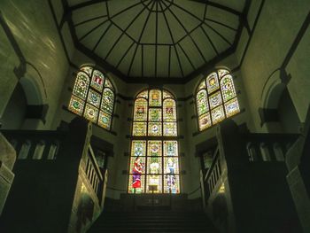 Low angle view of stained glass window