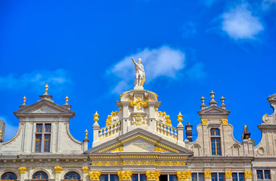 Low angle view of building against blue sky