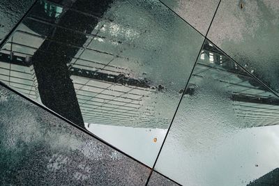 High angle view of wet swimming pool by building