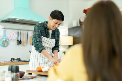 Mother and son on table at home
