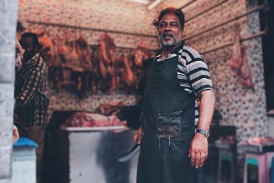 Man standing against wall