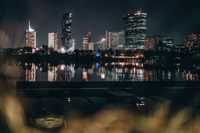 Illuminated buildings in city at night