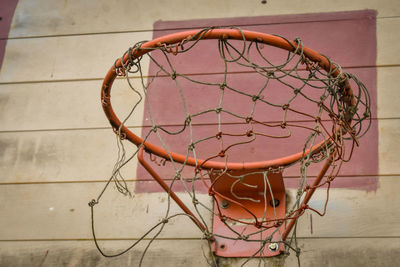 Low angle view of basketball hoop against wall