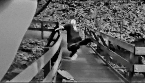 High angle view of woman walking on road