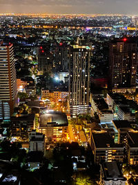 High angle view of illuminated city buildings at night