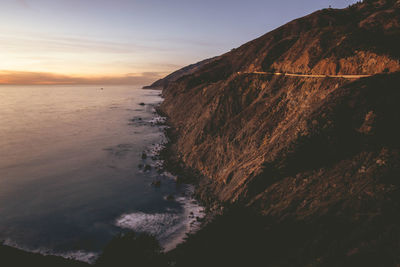Close-up of sea against sky at sunset