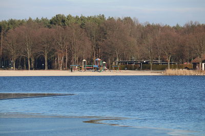 Scenic view of lake against trees