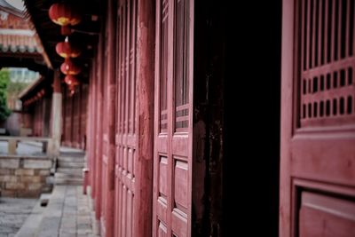 Close-up of red door of building