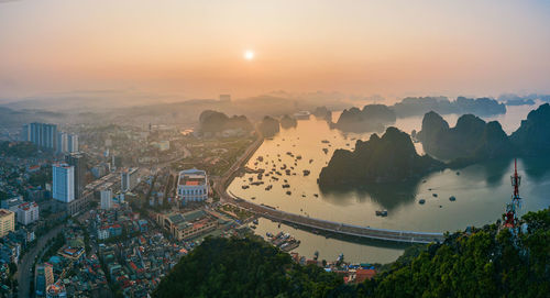 High angle view of buildings against sky during sunset