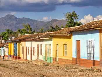 Houses on beach against sky