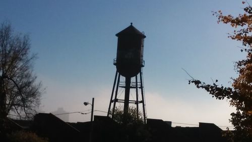 Low angle view of water tower against sky