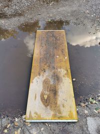 High angle view of puddle on road