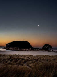 Scenic view of sea against the sky at night