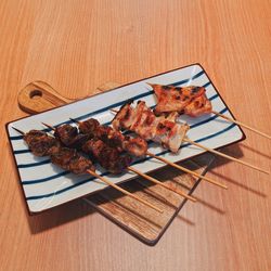 High angle view of meat on barbecue grill