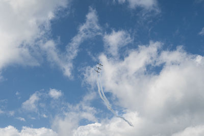 Low angle view of airplane flying in sky