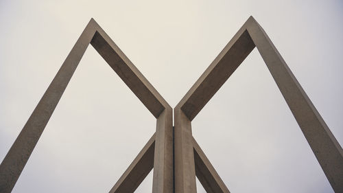 Low angle view of metallic structure against sky