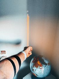 Low section of person holding umbrella