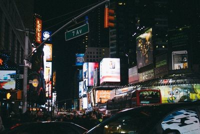 Illuminated city street at night