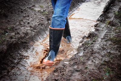 Low section of man standing on ground