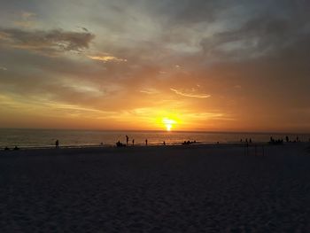 Scenic view of beach against sky during sunset