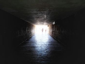 People walking in tunnel