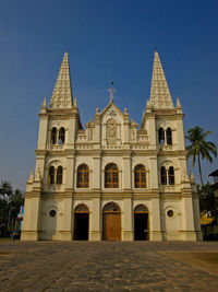 Facade of historic building against clear sky