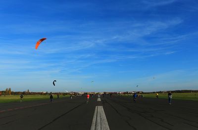 People on road against sky