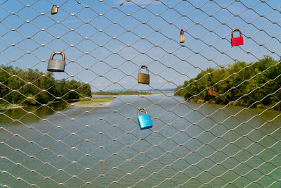 View of chainlink fence against blue sky