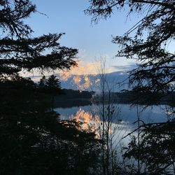 Scenic view of lake against sky during sunset