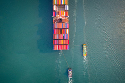 Container ship in export and import business and logistics. aerial view