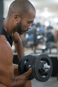 Young man with arms raised