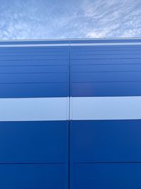 Full frame shot of building against blue sky