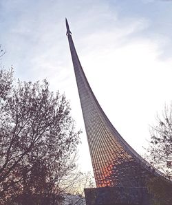 Low angle view of building against cloudy sky