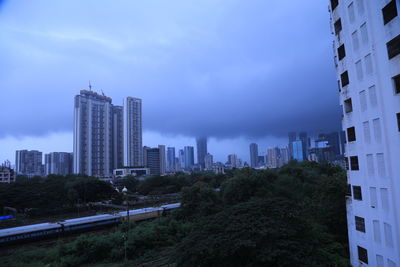 Buildings in city against sky