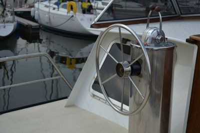 Close-up of sailboats moored in harbor