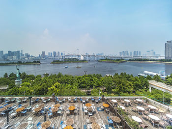 View of the bay of odaiba with daiba park,statue of liberty and rainbow bridge.