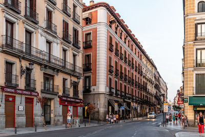 City street amidst buildings against sky