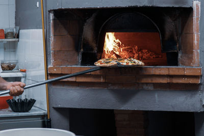 Man preparing food on barbecue grill