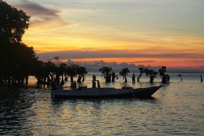 Scenic view of sea against orange sky