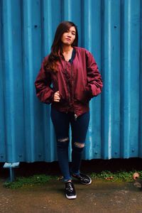 Portrait of young woman standing outdoors