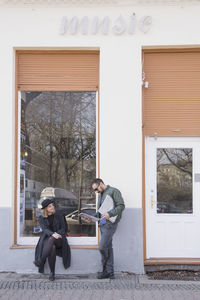 Young couple looking at records