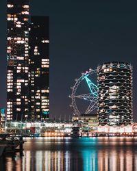 Illuminated buildings in city at night