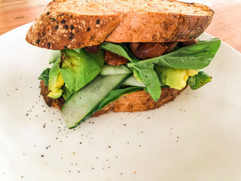 High angle view of breakfast avocado toast served on table