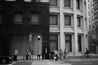 People walking on street in city