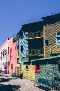 Multi colored houses against sky in city