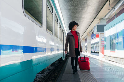 Elegant woman going for business trip on train