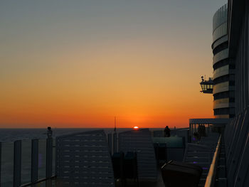 Scenic view of sea against clear sky during sunset