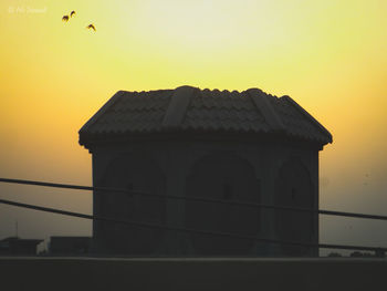 View of building against sky during sunset