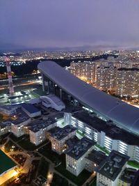 High angle view of illuminated buildings in city at night