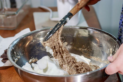 Close-up of hand holding ice cream